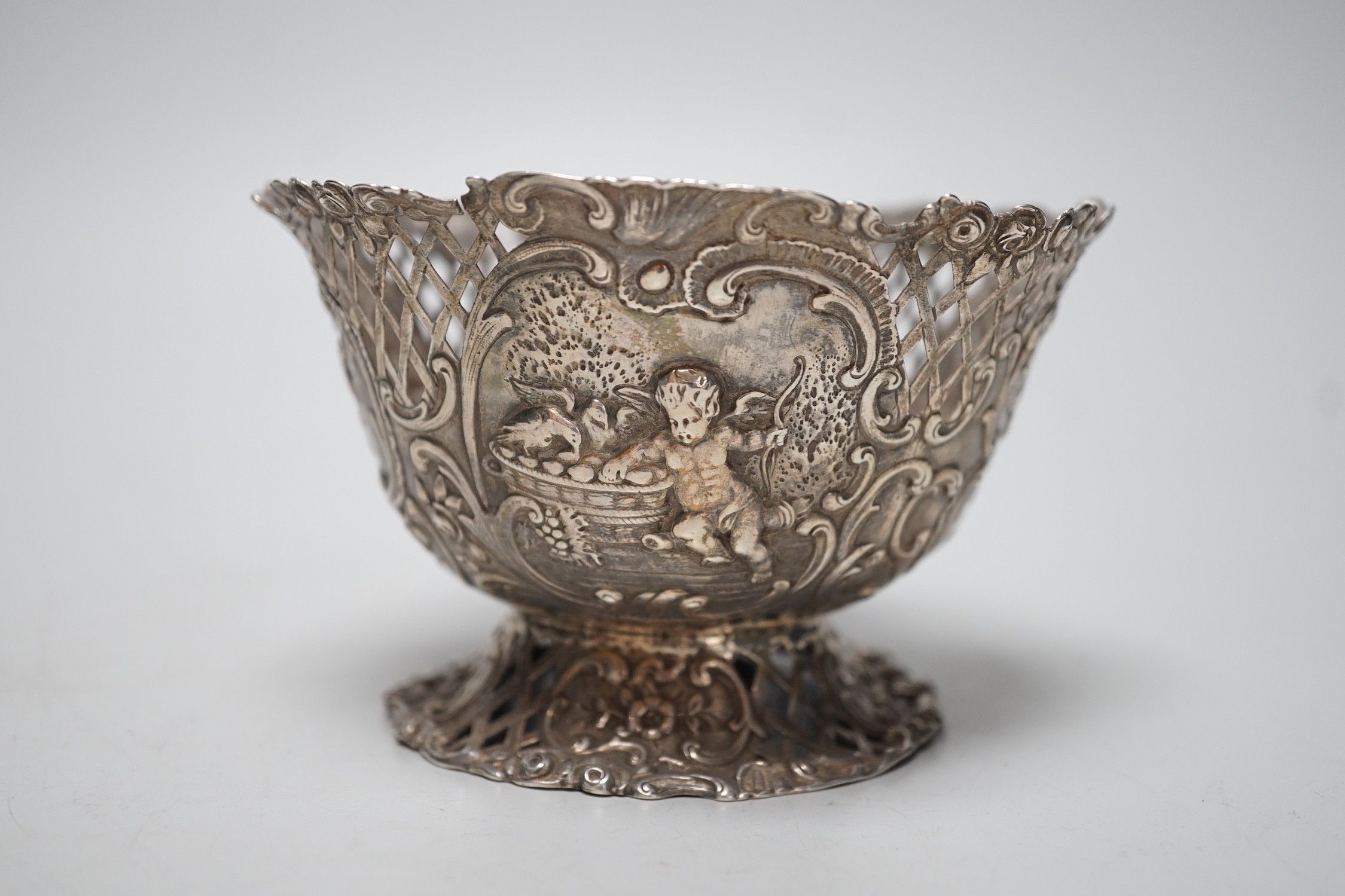 A late 19th century French pierced embossed silver bowl, on circular foot, import marks for William Moreing, London, 1894, diameter 12.2cm, 5.8oz.